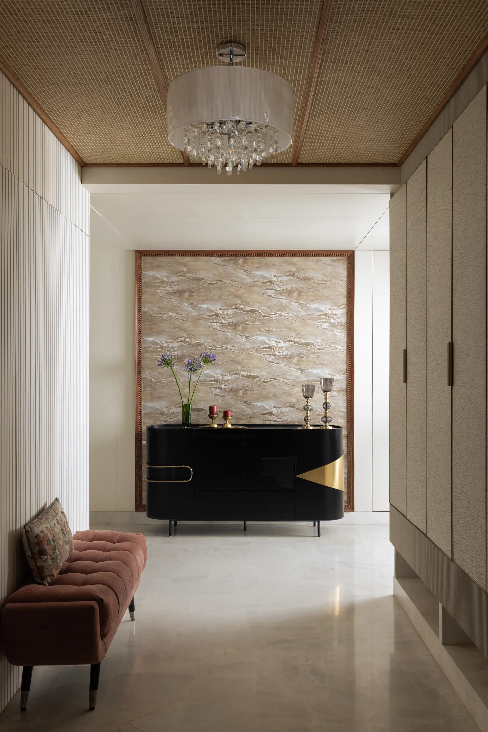 Hallway with timber ceiling, chandelier and black console — Seema Katta Svasa